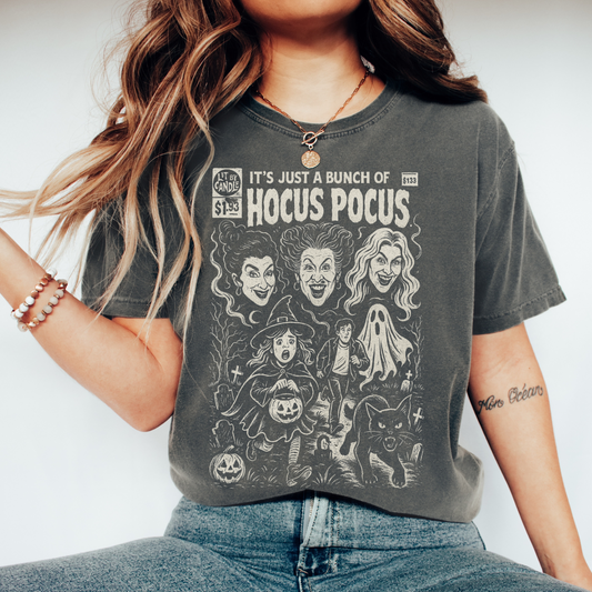 Person wearing a t-shirt with Hocus Pocus design and text.